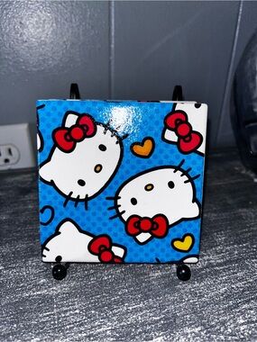 Hello Kitty Coasters w/black metal holder  
4 coasters  4x4x.25